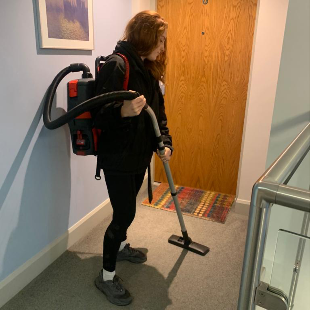 Hoovering a carpet